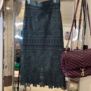 Topshop lace skirt with an underlying black shorter skirt underneath.